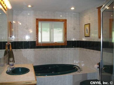 Bathroom Downstairs bath has jacuzzi & large glass