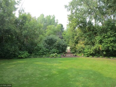 Gorgeous private wooded backyard overlooks pond.