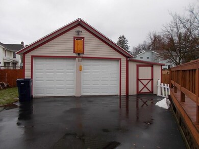 Paved driveway with extra parking near garage