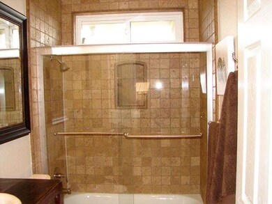 Main Bathroom with Tumbled Travertine Tile in the 