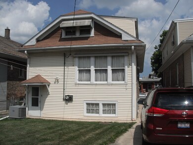 Rear entry to enclosed porch and basement