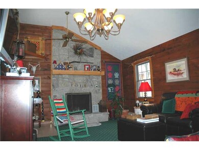 Family Room. The family room features a stone log 