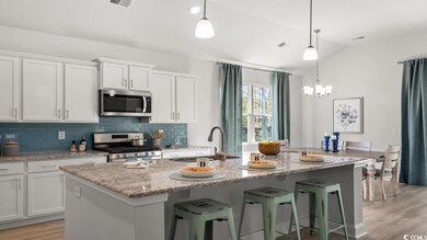 Kitchen featuring tasteful backsplash, appliances 