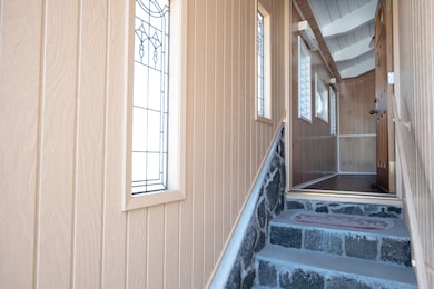 Stairway to main entry & foyer