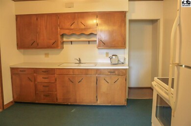 View of kitchen with stove and refrigerator
