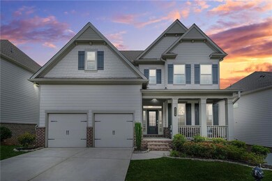 Craftsman-style home featuring a porch, an attached garage, concrete driveway, and brick siding