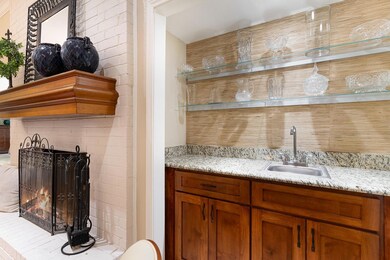 Bar featuring indoor wet bar and a sink