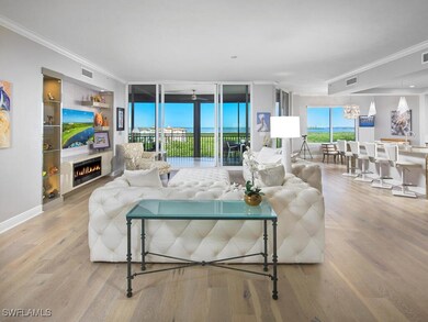 Living room with wood-type flooring, a notable cha