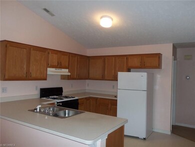 Kitchen offers plenty of cupboards and counter spa
