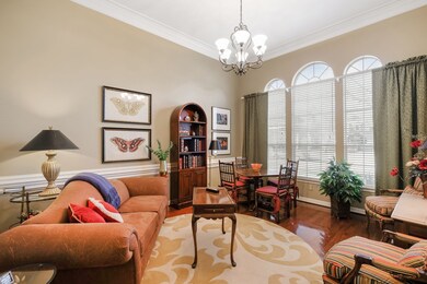 This charming room has so many possible uses! It can be a home office, formal living room, a music room, a room to play cards and have some adult beverages!