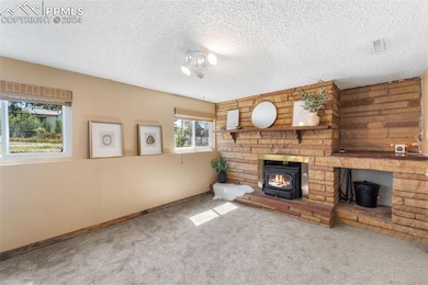 Floor to ceiling rock fireplace with wood burning 