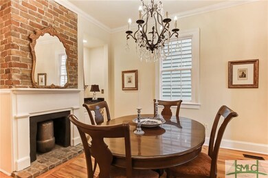 Dining room features lovely decorative fireplace.