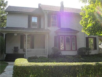 Exterior Front. Side view of house with address of