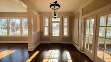 Doorway with ornamental molding, dark hardwood / w