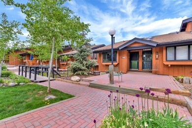 Rear view of house featuring a deck and board and