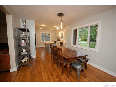 Open floor plan dining and kitchen space.