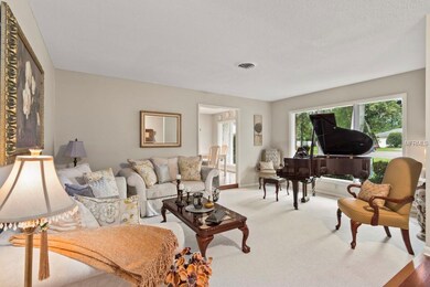 Formal Living room with large front windows and pl