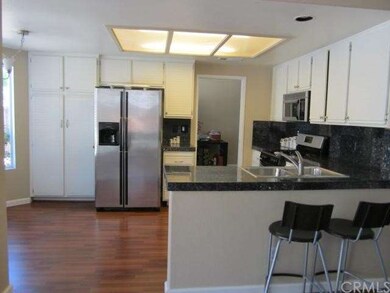 Wood laminate floor and stainless steel appliances