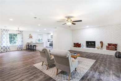 Open concept living with new bright lighting.