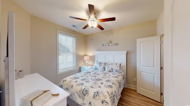 Bedroom featuring light hardwood / wood-style floo