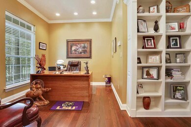 Large office with lots of built-in bookshelves. Th