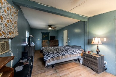  A spacious bed takes center stage, adorned with p