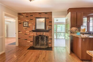 Cozy keeping room off kitchen with wood burning fi