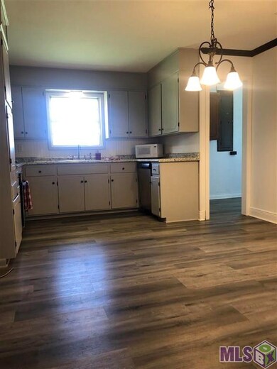 The Kitchen has wood vinyl flooring, new stainless