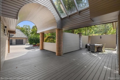 Wooden terrace featuring outdoor dining area