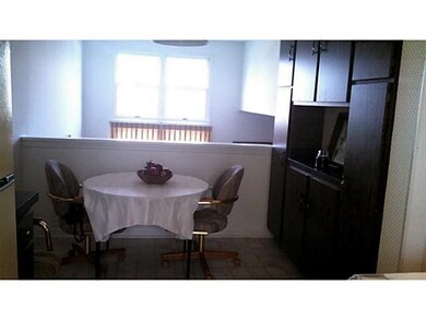 Kitchen. Charming eat-in area overlooks living roo
