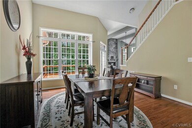 Two story dining room overlooking large deck