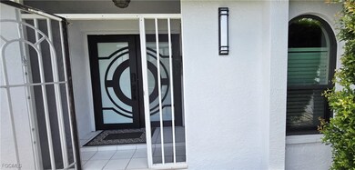 Entrance to property featuring stucco siding