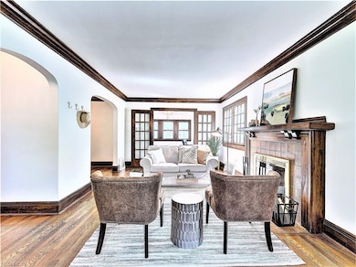 * ELEGANT ARCHED ENTRYWAY TO KITCHEN AND FORMAL DI