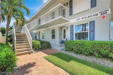 Doorway to property featuring stucco siding