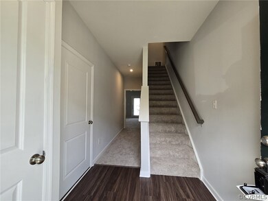 Stairway featuring hardwood / wood-style floors