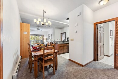 Dining room with baseboards, light tile patterned