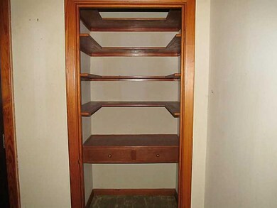 Other. media closet with shelving in living room