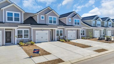 Townhome / multi-family property with a garage, a 