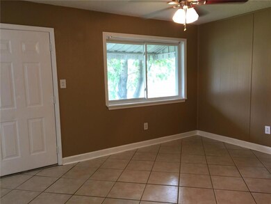 Living room is freshly painted, ceramic tile floor