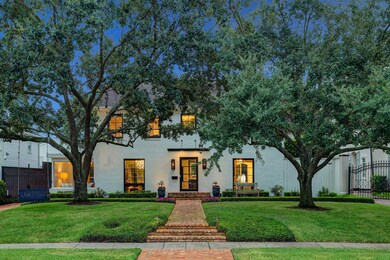 Beautiful oak trees, brick pathway, clipped boxwoods and subtle lighting greet you.