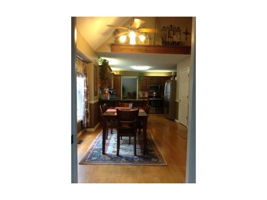 Kitchen has vaulted ceiling up to catwalk