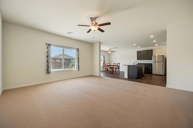 Unfurnished living room with visible vents, ceili