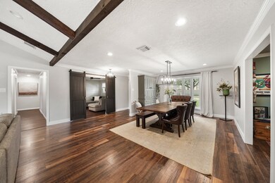 The formal dining room is located just off the foyer with a bay of windows overlooking the beautiful front yard.
