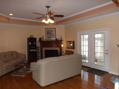 Welcoming Family Room, Fireplace with Mantel, Recess Lighting, Hardwood Flooring, French Doors leading out to Florida Room
