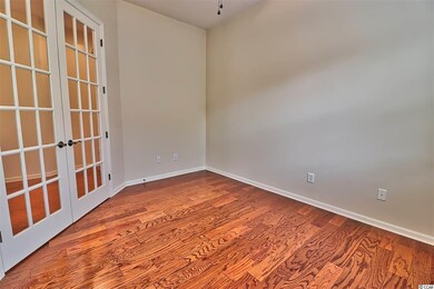French doors open into the room. The guest bathroo