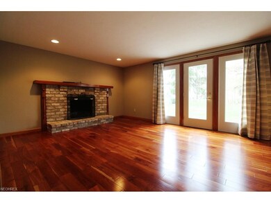 Spacious Family Room with Brick Fireplace and acce