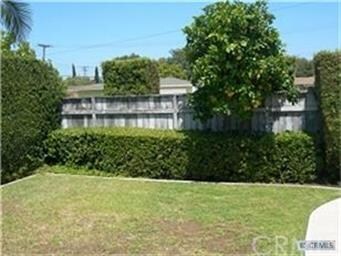 Private front courtyard with grapefruit tree.