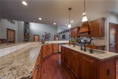 Gourmet kitchen with hardwood floor, large breakfa