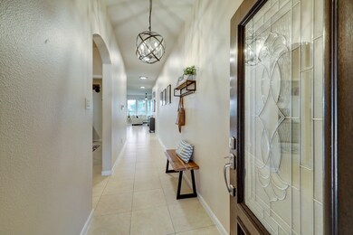 As you enter in the front door you are greeted by a wide foyer. To the left is guest living space, 2 bedrooms with a full bath between them. Spit floor plan. THIS HOME IS GORGEOUS!