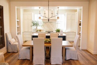 Dining space featuring dark wood-style flooring